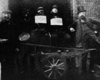 Guy Fawkes effigies and collectors, all masked, 1903, by John Benjamin Stone.